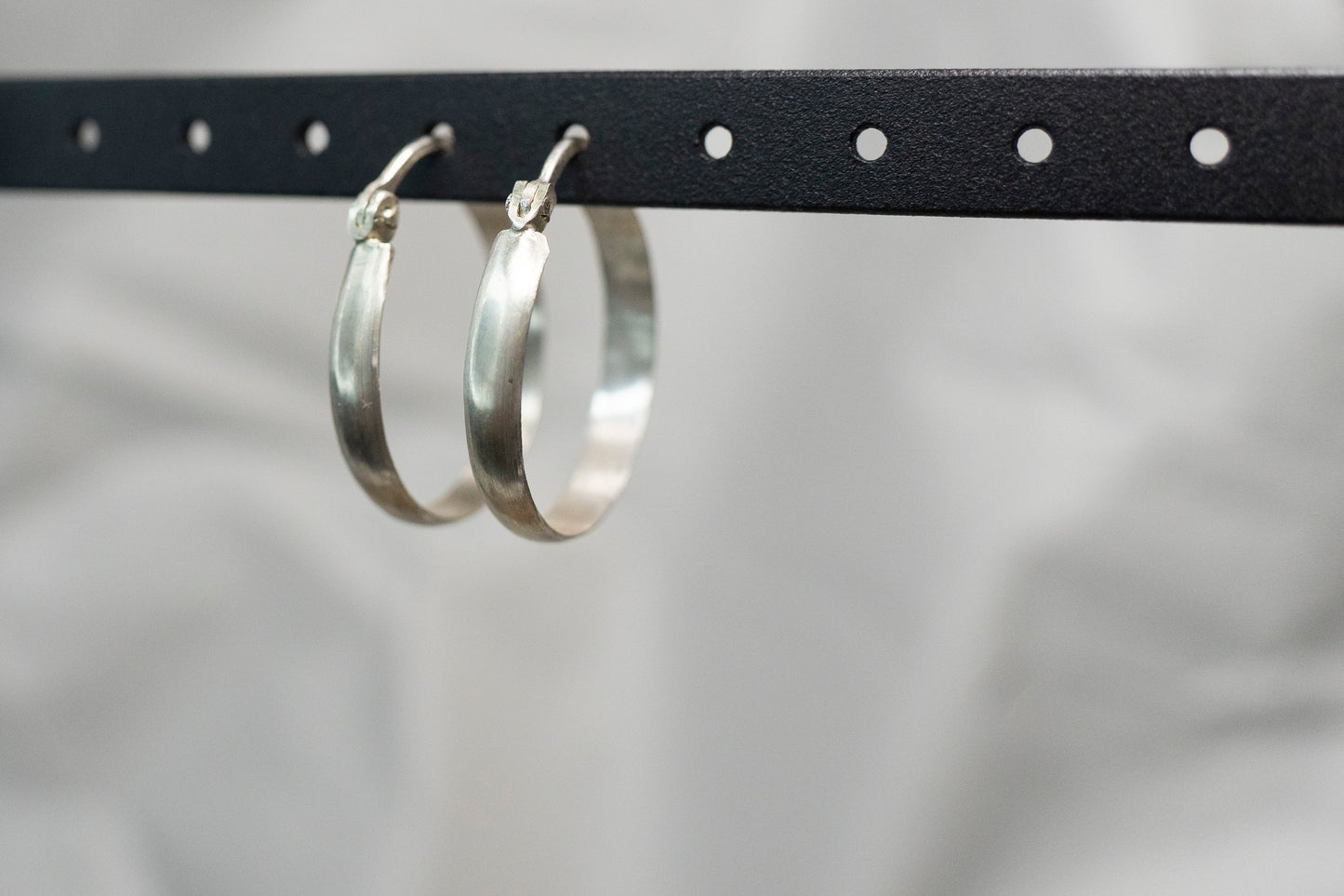 Hinged silver hoop earrings